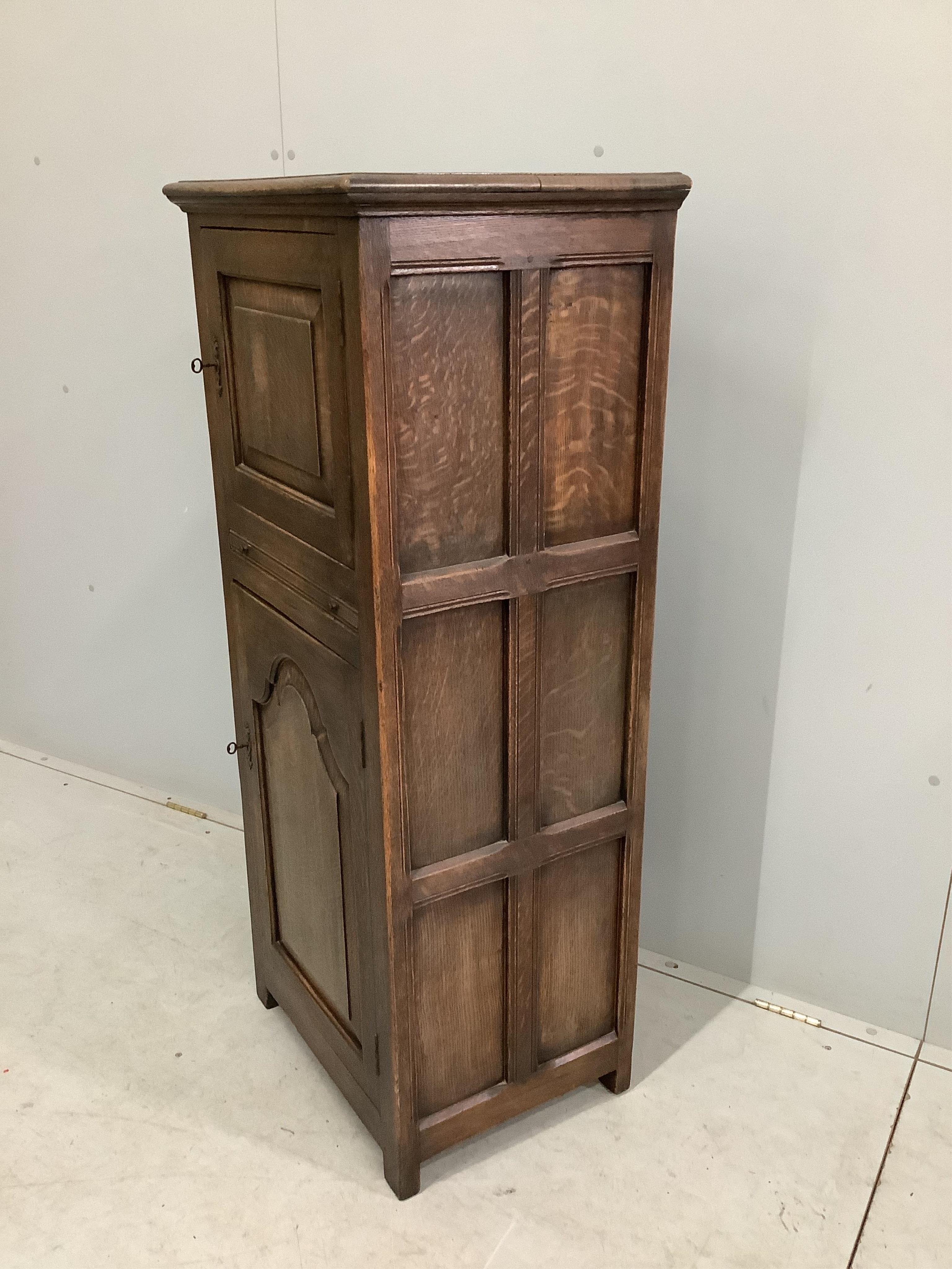 A 17th century style Ipswich oak cabinet, width 56cm, depth 42cm, height 129cm. Condition - fair to good